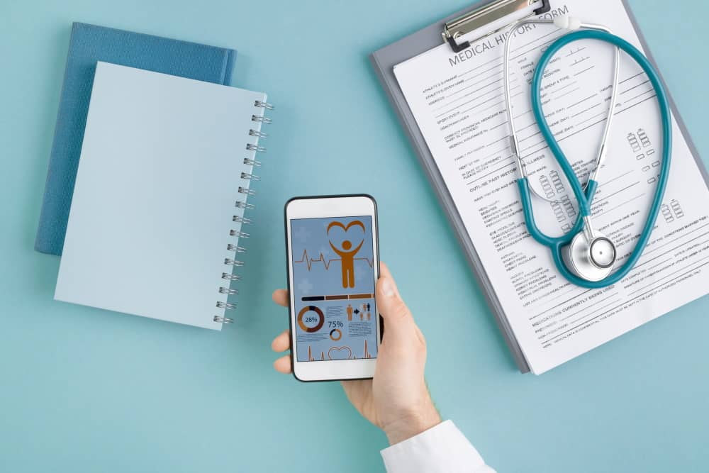 hand of cardiologist with smartphone scrolling thr VKZEY6J