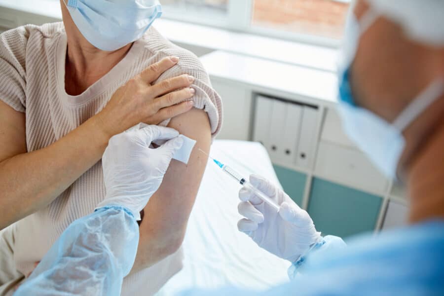 giving vaccine to woman 2021 09 24 04 11 37 utc scaled e1639142818582
